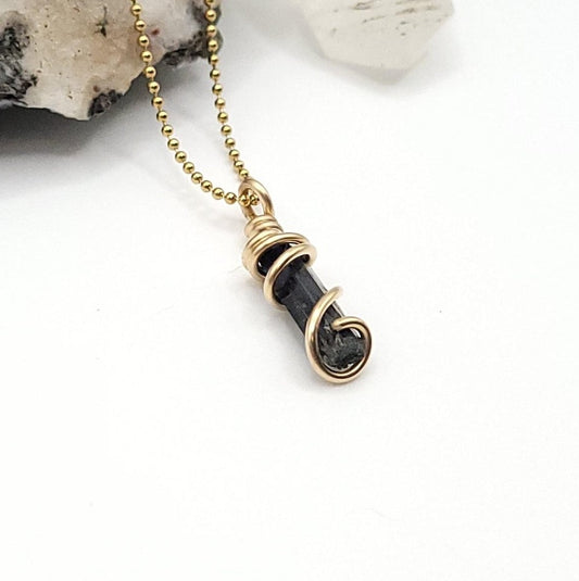 raw aegirine wrapped in gold filled wire on a gold plated ball chain