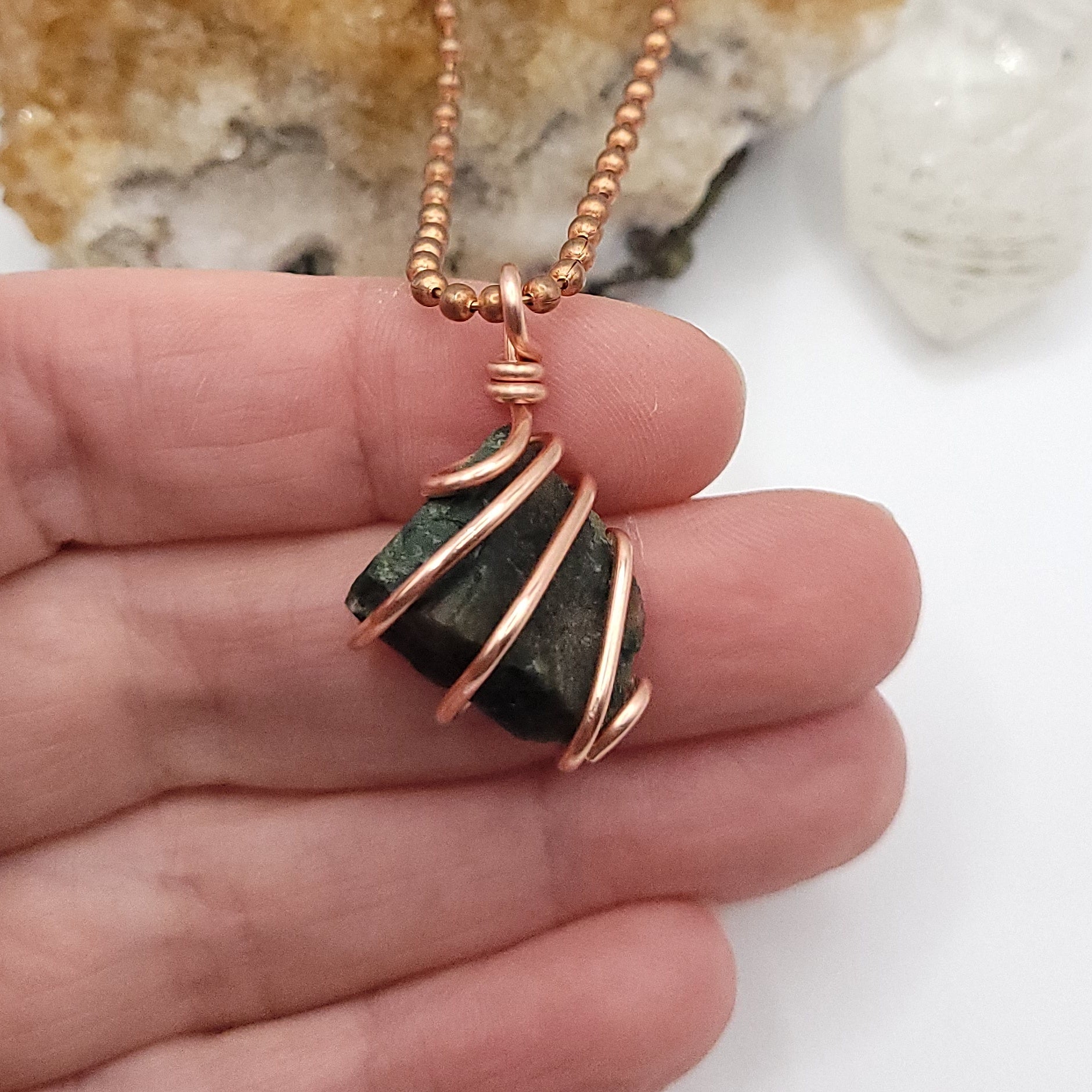 Raw Bloodstone Crystal Necklace in Copper Wire, in hand