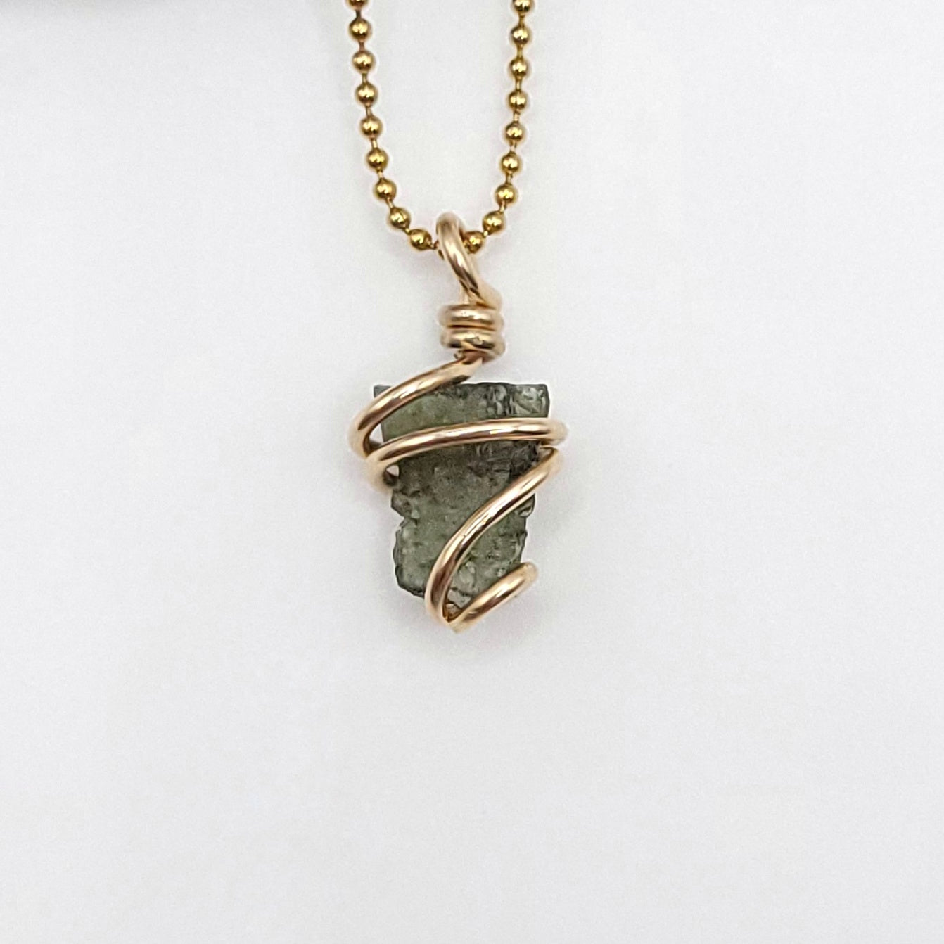 Raw Moldavite Crystal Necklace in gold close up