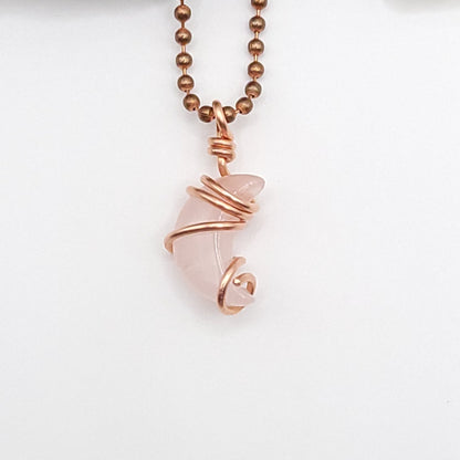 Rose quartz Crescent Moon crystal necklace in copper close up