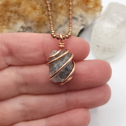 Raw Lazulite Crystal Necklace in Copperin hand