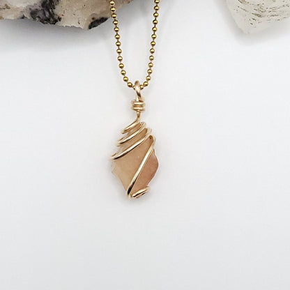 raw libyan desert glass wrapped in gold filled wire on a gold ball chain