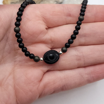 Onyx Evil Eye Necklace featuring 4mm Obsidian and Pyrite beads for grounded protection and empowerment.