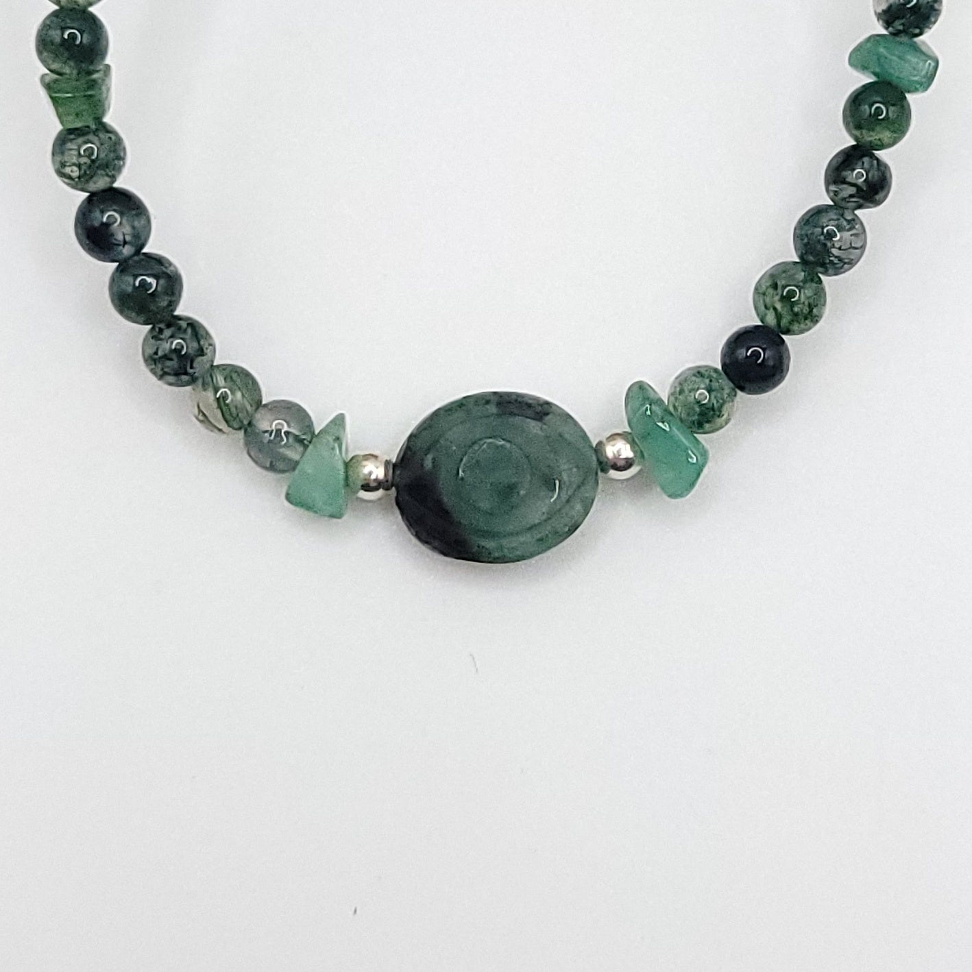 Emerald Evil Eye Necklace featuring Green Moss Agate and Emerald chip beads for heart healing and emotional balance.