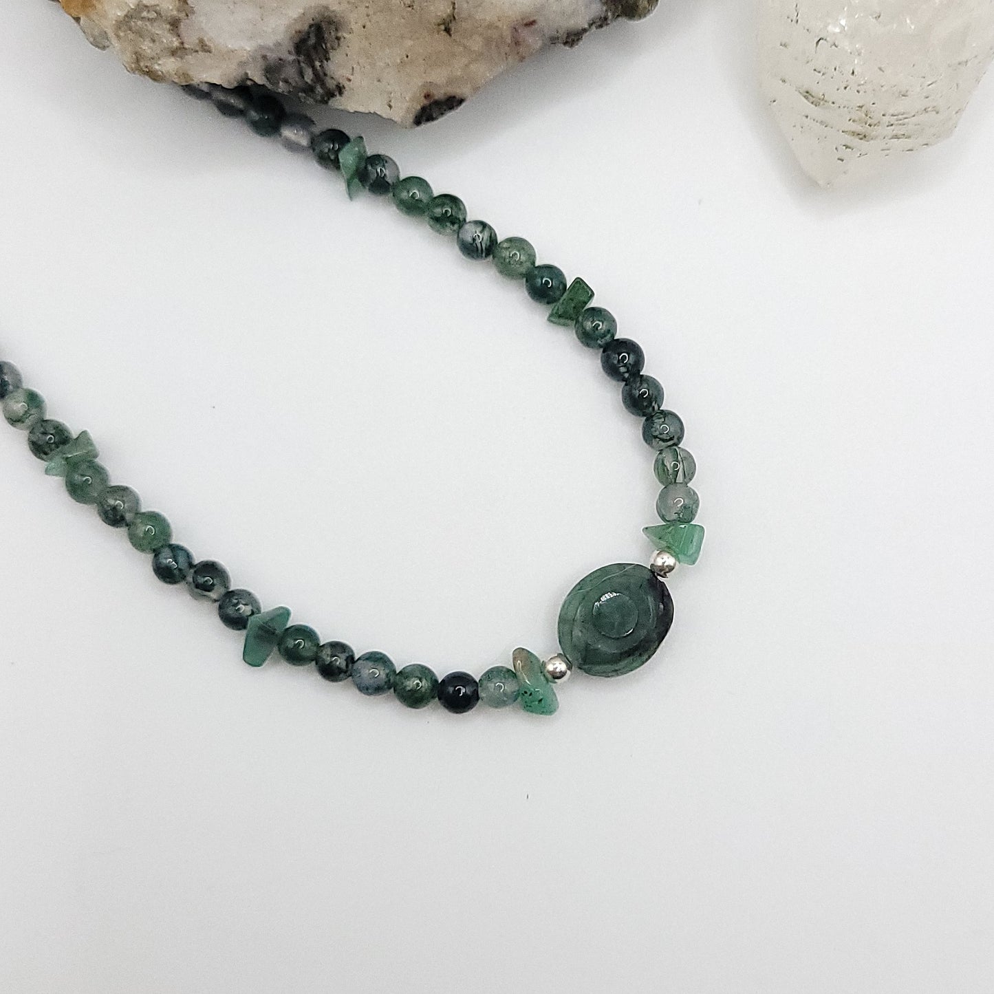 Emerald Evil Eye Necklace featuring Green Moss Agate and Emerald chip beads for heart healing and emotional balance.