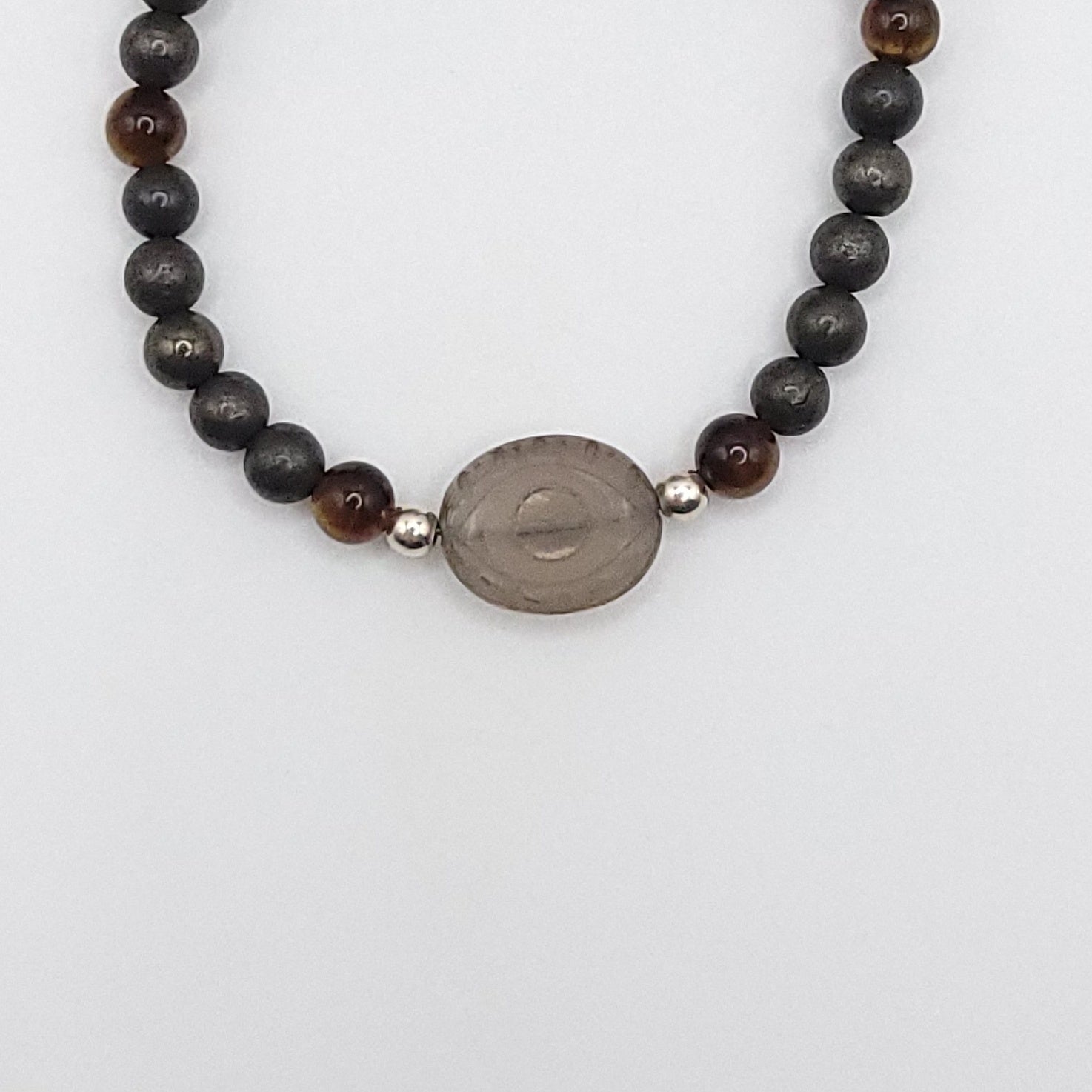 Smoky Quartz Evil Eye necklace featuring Pyrite and Tiger’s Eye beads for grounded confidence and empowerment.