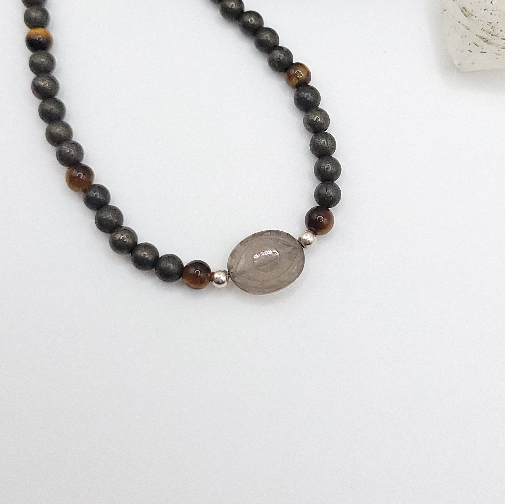 Smoky Quartz Evil Eye Necklace featuring Pyrite and Tiger’s Eye beads for grounded confidence.