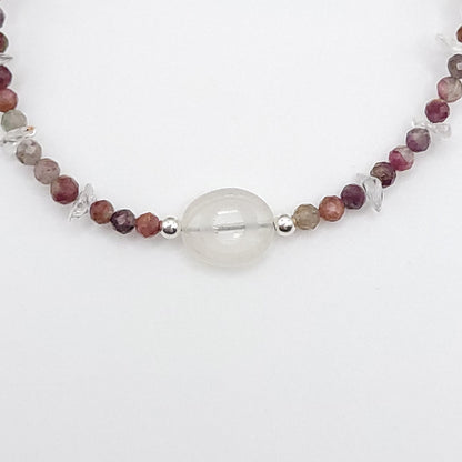 Close-up of a Clear Quartz Evil Eye Necklace featuring Multi-Color Tourmaline and sterling silver accents.