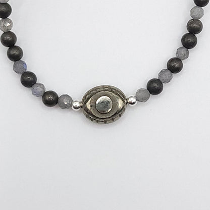 Pyrite Evil Eye necklace featuring 4mm Pyrite and 3mm Labradorite beads for protective strength