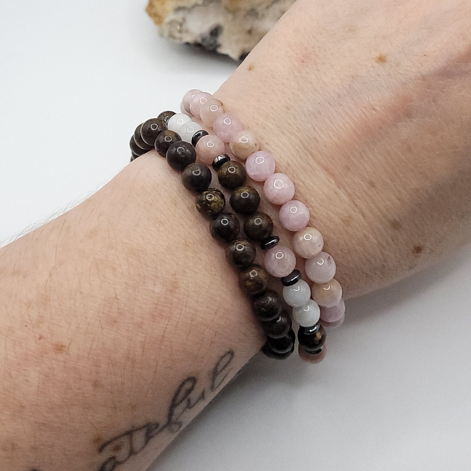 kunzite, bronzite, moonstone 3 bracelet stack on wrist