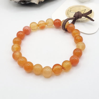 carnelian bracelet, 7" beaded stretch bracelet on white background