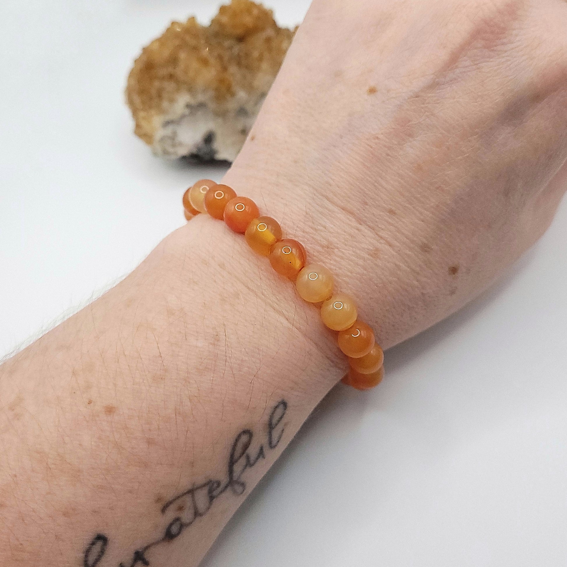 carnelian bracelet, 7" beaded stretch bracelet on wrist