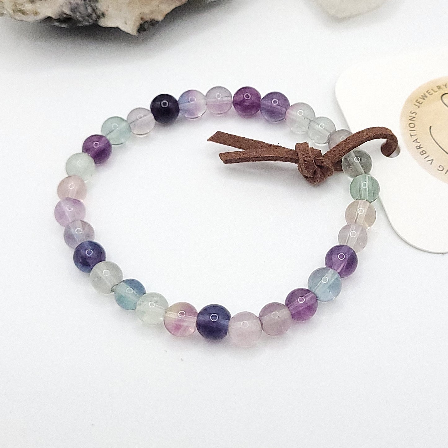 rainbow fluorite bracelet, 7" beaded stretch bracelet on white background
