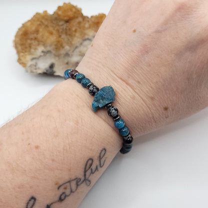 Blue Apatite Garnet & Snowflake Obsidian bracelet on wrist