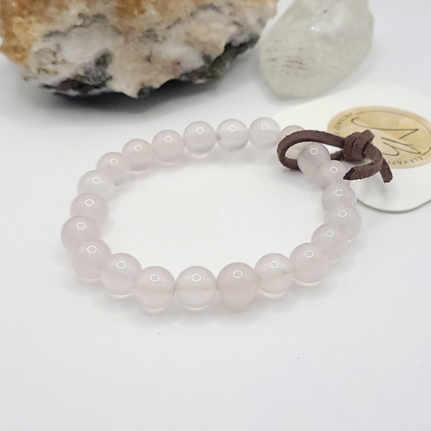 8mm rose quartz bracelet on white background