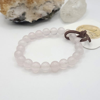 8mm rose quartz bracelet on white background