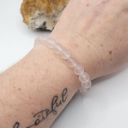 rose quartz bracelet on wrist