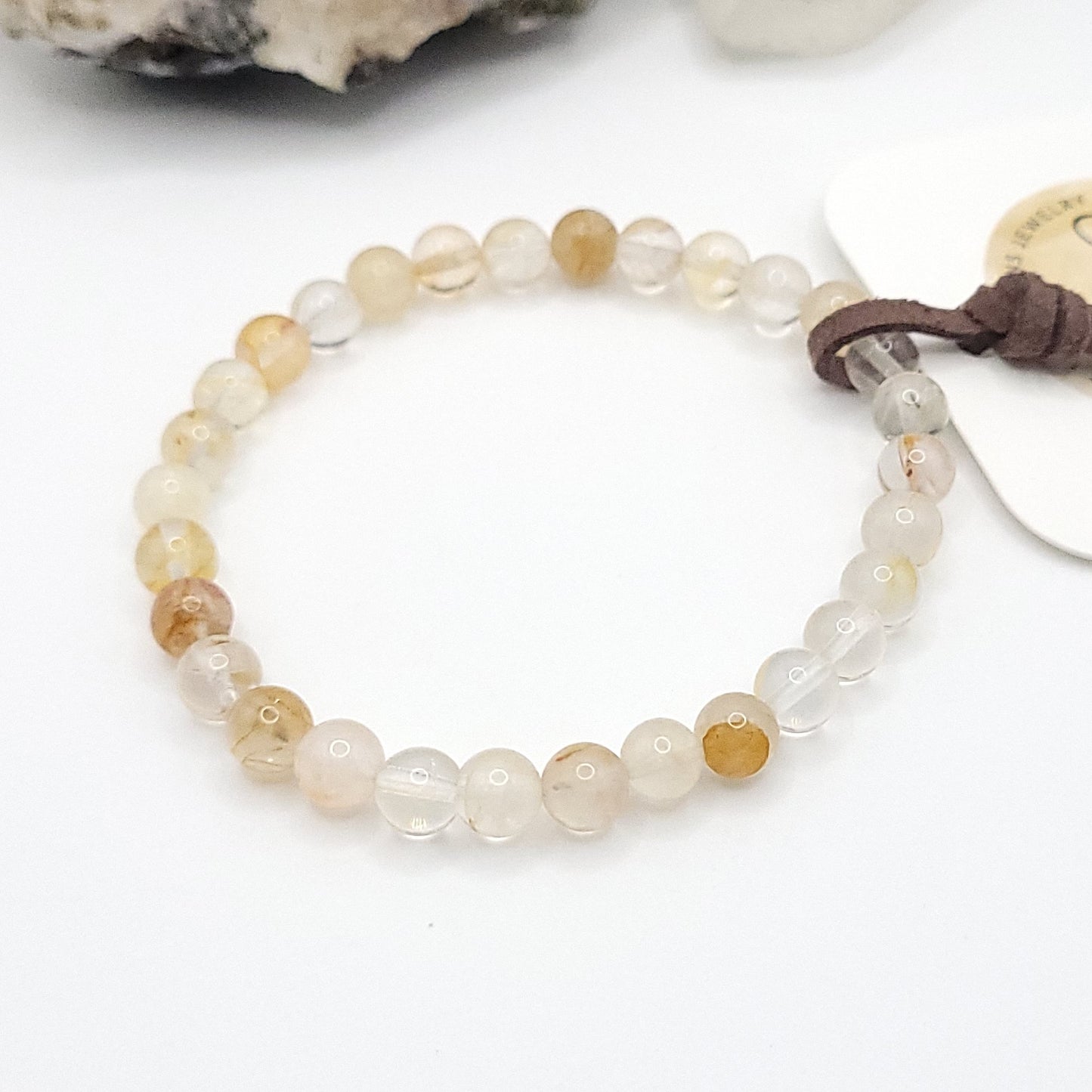 golden healer bracelet, 7" beaded stretch bracelet on white background