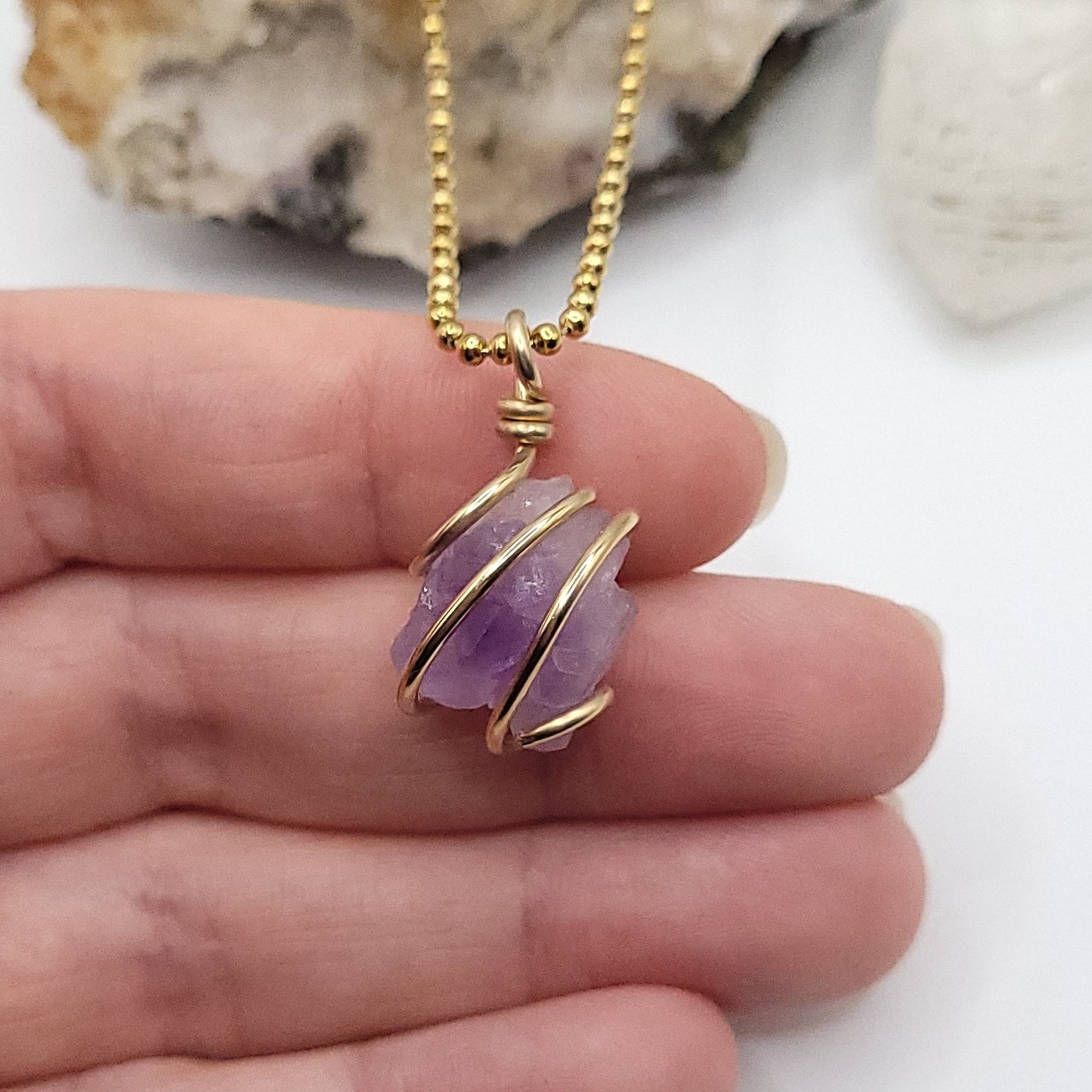 raw amethyst necklace in 14k gold filled wire in hand
