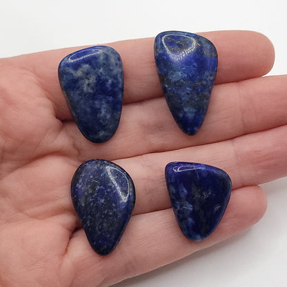 4 polished lapis lazuli in hand to choose from for lapis lazuli necklace in copper