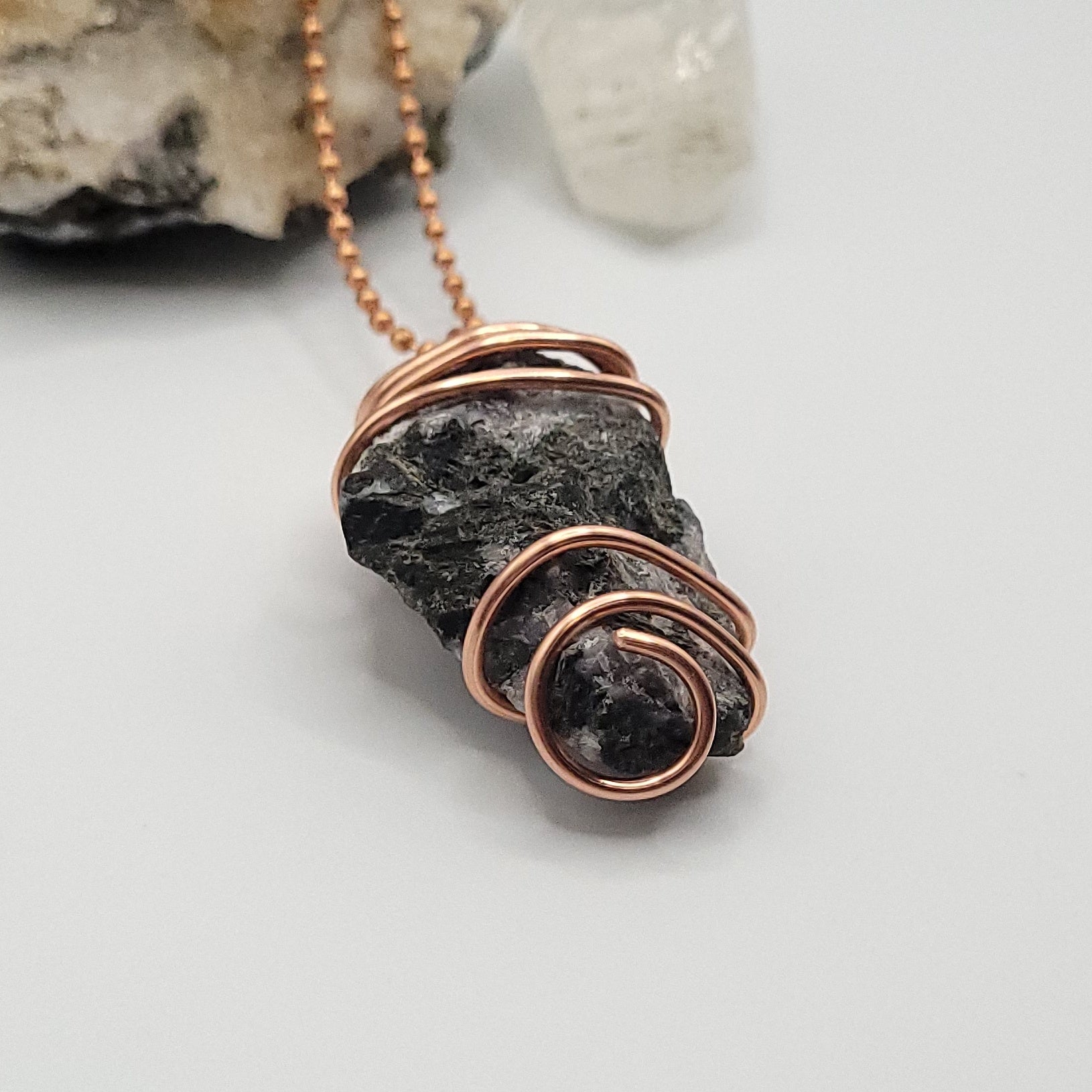 raw mystic merlinite necklace in copper wire on a copper ball chain side view
