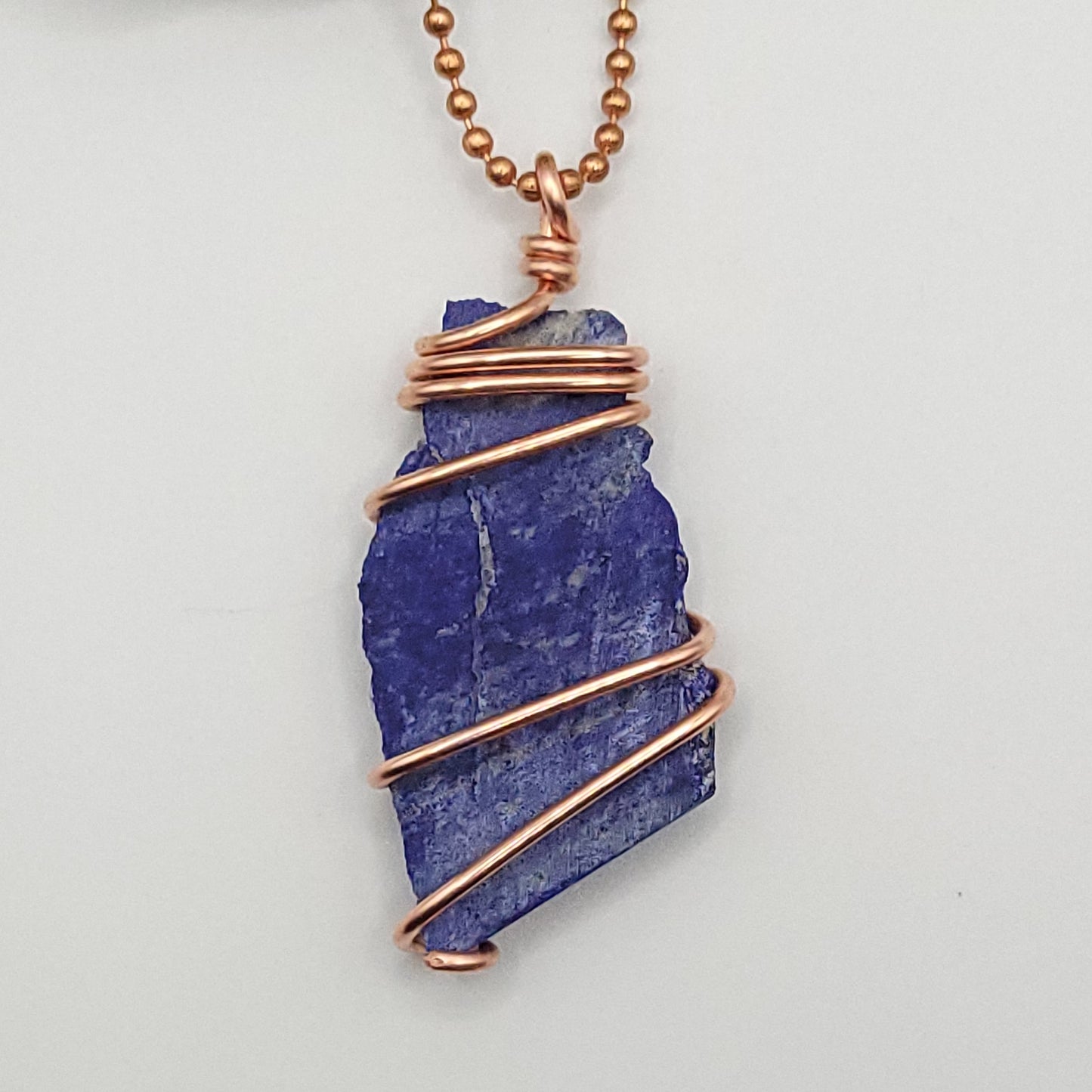 lapis lazuli necklace in copper wire on a copper ball chain close up