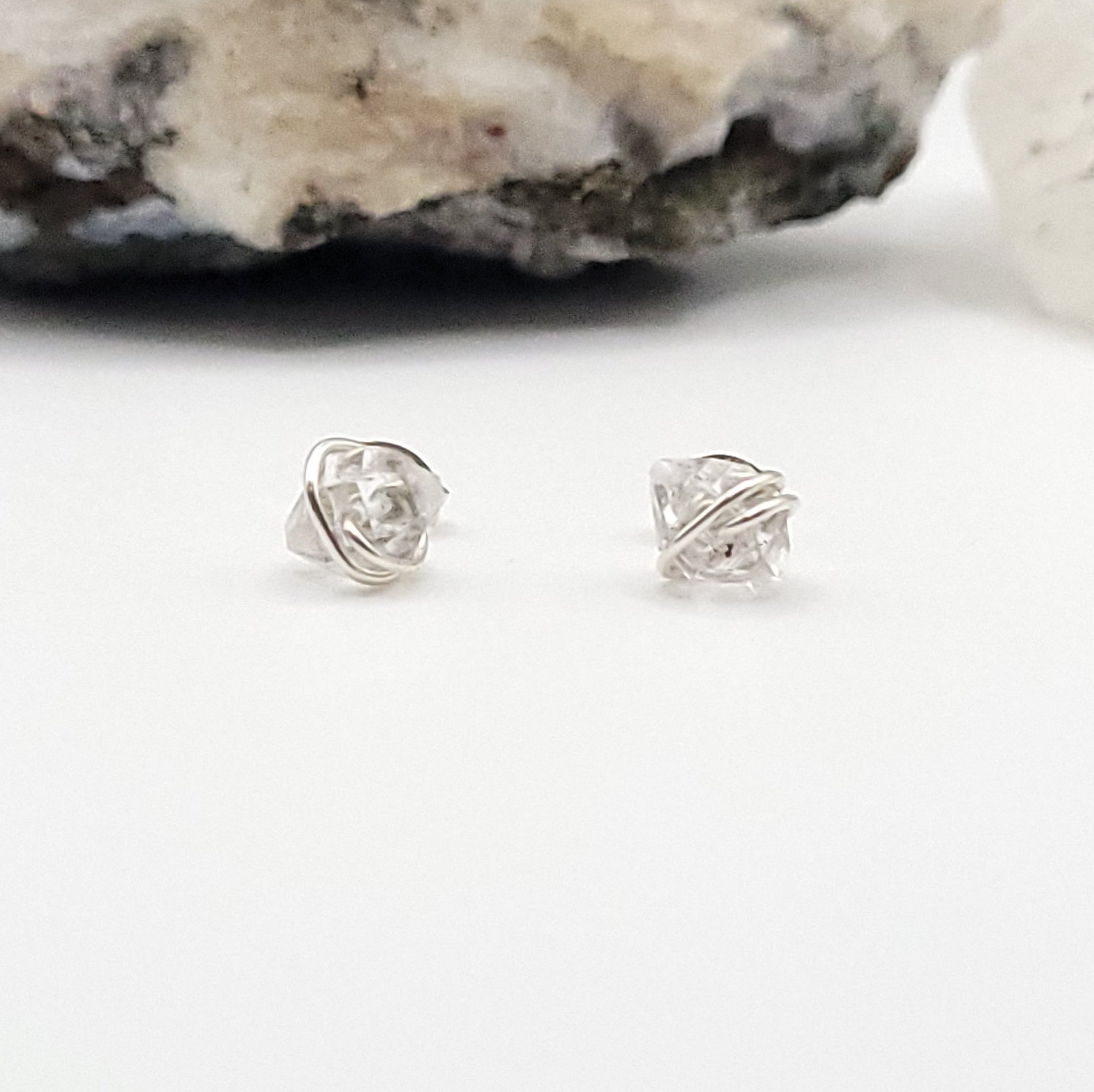sterling silver herkimer diamond stud earrings on a white background