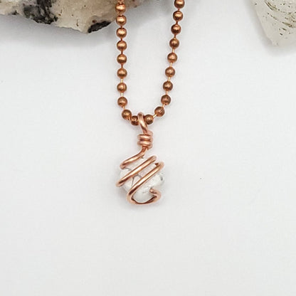 howlite necklace in copper wire in hand