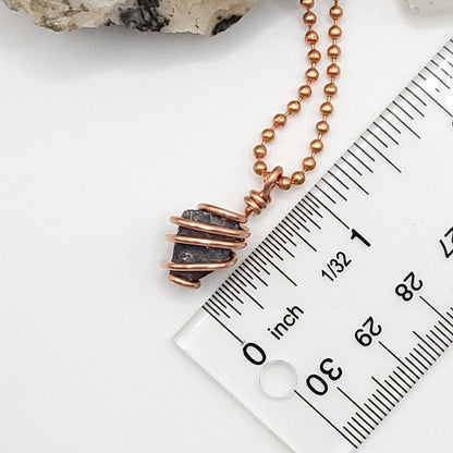 raw galena necklace next to ruler measuring about one inch